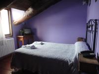 A bed or beds in a room at Hostal Venta Liara