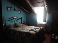 A bed or beds in a room at Hostal Venta Liara