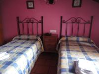 A bed or beds in a room at Hostal Venta Liara