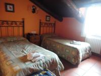 A bed or beds in a room at Hostal Venta Liara