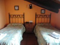 A bed or beds in a room at Hostal Venta Liara