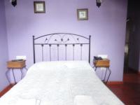 A bed or beds in a room at Hostal Venta Liara
