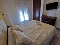 Postel nebo postele na pokoji v ubytování Hotel Doña Carmen