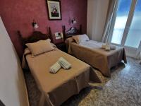 Postel nebo postele na pokoji v ubytování Hotel Doña Carmen