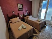 Postel nebo postele na pokoji v ubytování Hotel Doña Carmen