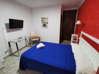 Postel nebo postele na pokoji v ubytování Hotel Doña Carmen