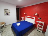 Postel nebo postele na pokoji v ubytování Hotel Doña Carmen