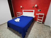 Postel nebo postele na pokoji v ubytování Hotel Doña Carmen
