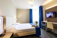 Posteľ alebo postele v izbe v ubytovaní Hotel Oleggio Malpensa