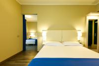 Posteľ alebo postele v izbe v ubytovaní Hotel Oleggio Malpensa