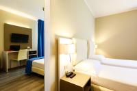 Posteľ alebo postele v izbe v ubytovaní Hotel Oleggio Malpensa