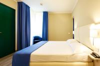 Posteľ alebo postele v izbe v ubytovaní Hotel Oleggio Malpensa