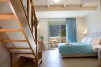 Postel nebo postele na pokoji v ubytování Grand TheoNi Boutique Hotel & Spa