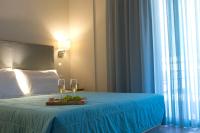 Postel nebo postele na pokoji v ubytování Grand TheoNi Boutique Hotel & Spa