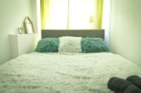 Posteľ alebo postele v izbe v ubytovaní Apartament Asia