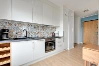 Kuchnia lub aneks kuchenny w obiekcie Gdansk Comfort Apartments Bursztynowa