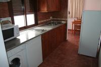 Kuchyň nebo kuchyňský kout v ubytování Apartamentos Sierra del Hacho