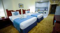 Green House Hotel Suites & Apartmentにあるベッド