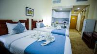 Green House Hotel Suites & Apartmentにあるベッド