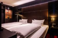 two beds in a hotel room with white pillows at Hotel Haverkamp in Bremerhaven