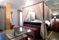 A bed or beds in a room at Hotel Casa del Abad
