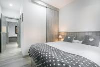 A bed or beds in a room at Adriana by Totiaran