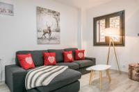 A seating area at Adriana by Totiaran