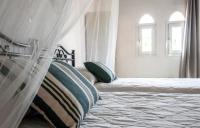 Posteľ alebo postele v izbe v ubytovaní Stavros Villas&Apartments