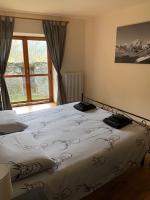 A bed or beds in a room at San Marco FARMHOUSE with a view.