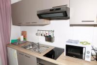 Kuchyň nebo kuchyňský kout v ubytování Apartment Magnolija - free parking