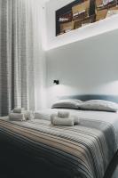 A bed or beds in a room at Terno su Napoli