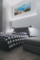 A bed or beds in a room at Terno su Napoli