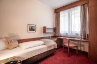 Cama ou camas em um quarto em Aparthotel Andreas Hofer