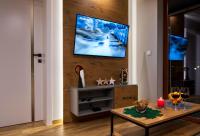 Telewizja i/lub zestaw kina domowego w obiekcie Apartament MOUNTSEA ,Karpacz Ogrodnicza