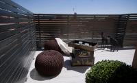 a patio with two chairs and a fence at Salamanca Suite Studios in Salamanca