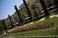 a park with flowers and trees and buildings at Salamanca Suite Studios in Salamanca