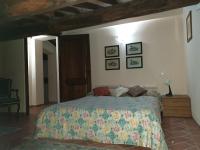 A bed or beds in a room at Podere il Poggio