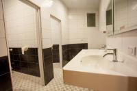 a bathroom with a sink and a shower at Gene Long Haiy Att Hotel in Chiayi City