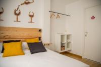 Postel nebo postele na pokoji v ubytování Tinto Dreams Hostel