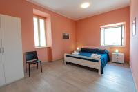 A bed or beds in a room at "Il Segreto" Vista Panoramica sulle Isole Eolie con Piscina, palestra e WiFi