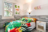 A bed or beds in a room at CASA FLAMINGO