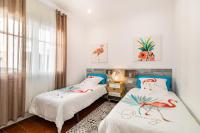 A bed or beds in a room at CASA FLAMINGO