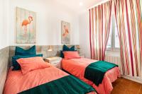 A bed or beds in a room at CASA FLAMINGO