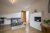 Televízia a/alebo spoločenská miestnosť v ubytovaní Ferienwohnung Ager-Bucher