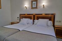 Postel nebo postele na pokoji v ubytování Hotel Don Curro