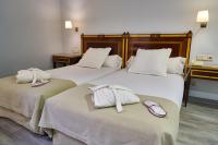 Postel nebo postele na pokoji v ubytování Hotel Don Curro