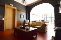 a living room with a couch and a coffee table at La Citadine in Neufchâteau