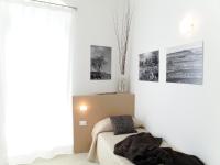 A bed or beds in a room at Le Stanze Del Sole