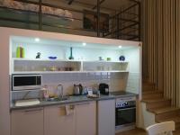 A kitchen or kitchenette at Tempo Life Apartman
