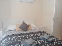 Postel nebo postele na pokoji v ubytování Galatex Beach Apartment